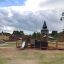 Venkovní Campanille playground castle se skluzavkou a lezeckými prvky.
