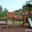 Triangle Modern Nature wooden playhouse with slide v parku zdobeném barevnými balónky