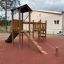 Triangle Modern Nature wooden playhouse with slide na venkovním hřišti