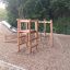 Caucasus wooden playhouse se skluzavkou a lezeckou konstrukcí na hřišti