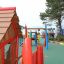 Anna's Playhouse dřevěné hřiště s barevnými herními prvky pro děti.