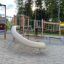 El Dorado wooden playhouse s klouzačkou a lezeckými konstrukcemi na hřišti