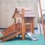 Tambora wooden playhouse with slide na hřišti s lezeckou stěnou a zeleným bezpečnostním povrchem