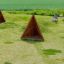 Sada herních prvků Tipi Nature wooden house na travnatém poli