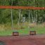 Wooden Baby double swing v parku.