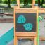 Forest Treehouse playhouse with slide na hřišti ze dřeva se zelenými akcenty