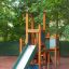 Tower with Slide dřevěná herní konstrukce s lezeckými stěnami a zelenou skluzavkou