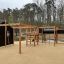 Motor Function Center Nature, wooden playhouse v parku.