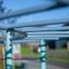 Venkovní herní vybavení, Dolphin steel structure, detail světle modrých vodorovných tyčí.