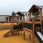 Knight's Castle Nature playhouse with slide na hřišti.