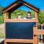 Děti si hrají v Knight's Castle Nature playhouse with slide.