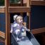 Děti si hrají na Tower Nature wooden playhouse with slide.
