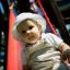 Batole si hraje na Toddler Tower Slide na hřišti.