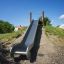 Nerezová skluzavka Hill Slide h150 na venkovním hřišti.