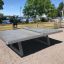Concrete table tennis, free-standing na venkovní terase u vody.