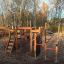 Panther wooden playhouse se skluzavkami a lezeckými konstrukcemi na hřišti