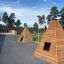 Wigwam wooden house na školním hřišti se stromy v pozadí