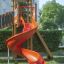 Twister castle with slide v prostředí hřiště