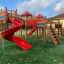Space Station castle with slide, venkovní herní vybavení s červenými skluzavkami a lezeckou konstrukcí