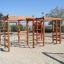 Activity Center wooden playhouse s lezeckými rámy a žebříky na hřišti