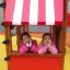 Dvě dívky v Logo Tower with Firepole playhouse with slide.