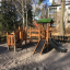 Smart Modern Nature wooden playhouse with slide v prostředí hřiště
