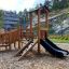 Smart Modern Nature wooden playhouse with slide ve venkovním prostředí