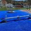 Single Seesaw na modrém povrchu hřiště