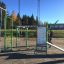 Venkovní fitness vybavení Information Board NAF s tréninkovými pokyny v prostředí parku.